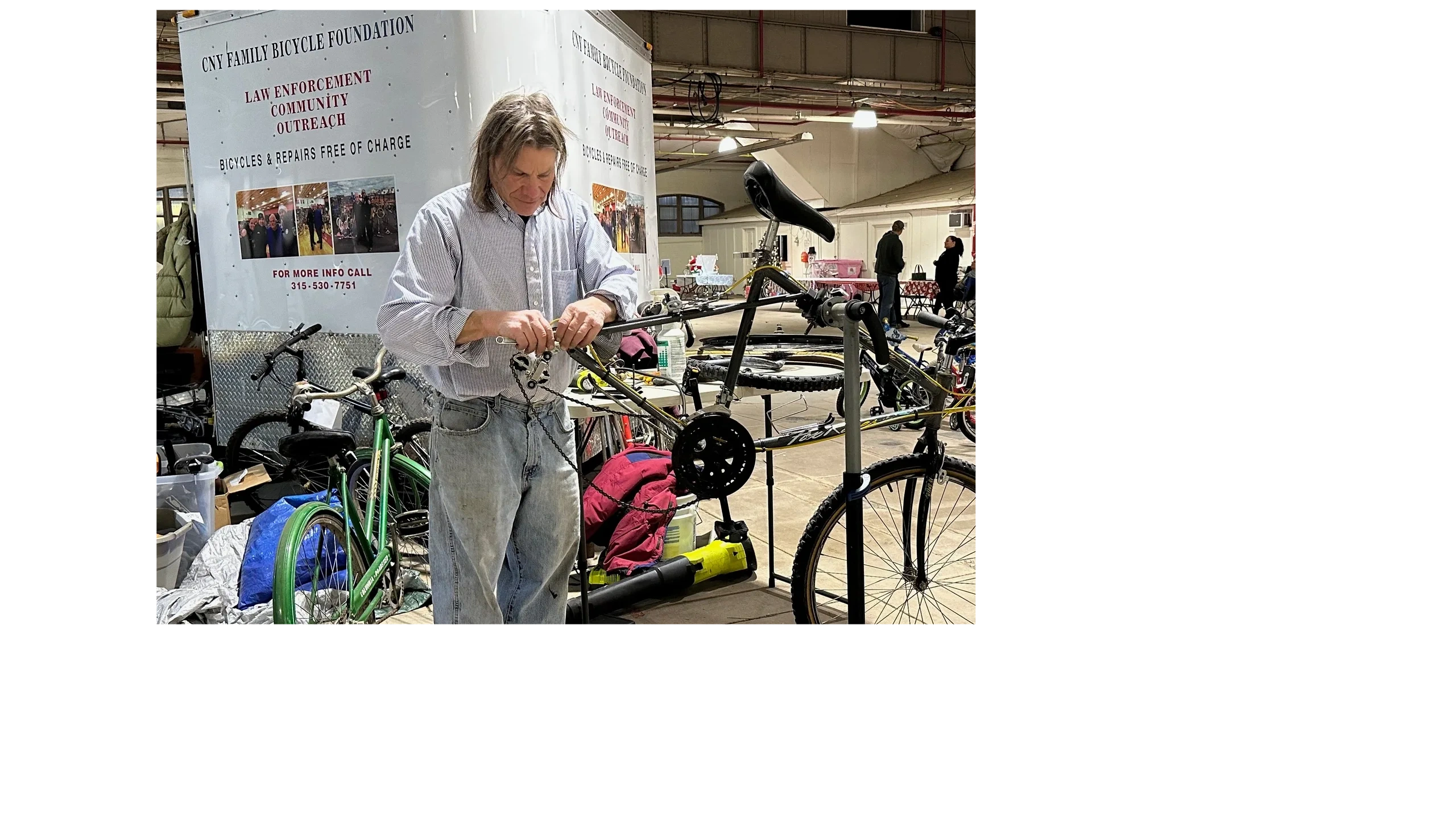 Volunteer repairing a donated bike